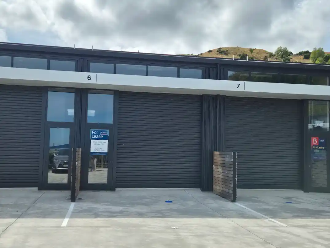 Units 6 and 7 exterior with For Lease sign